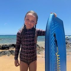 a girl standing on a beach