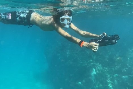 a man swimming in a pool of water