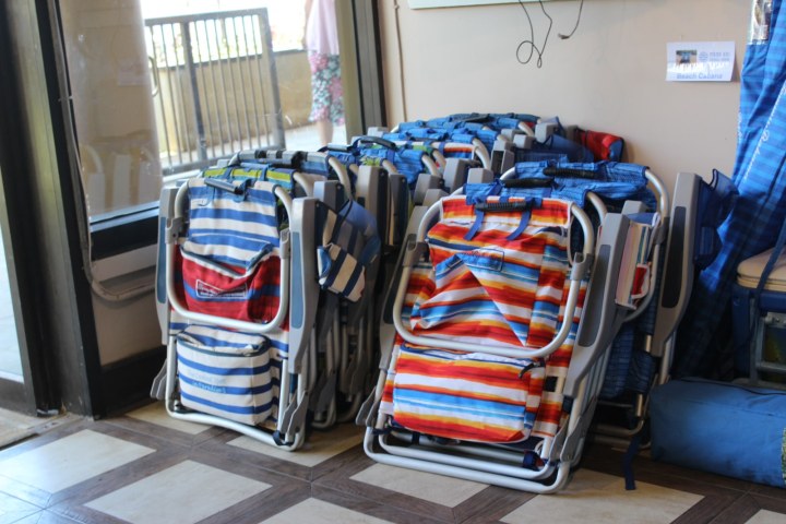 a bedroom with a bed and desk in a room