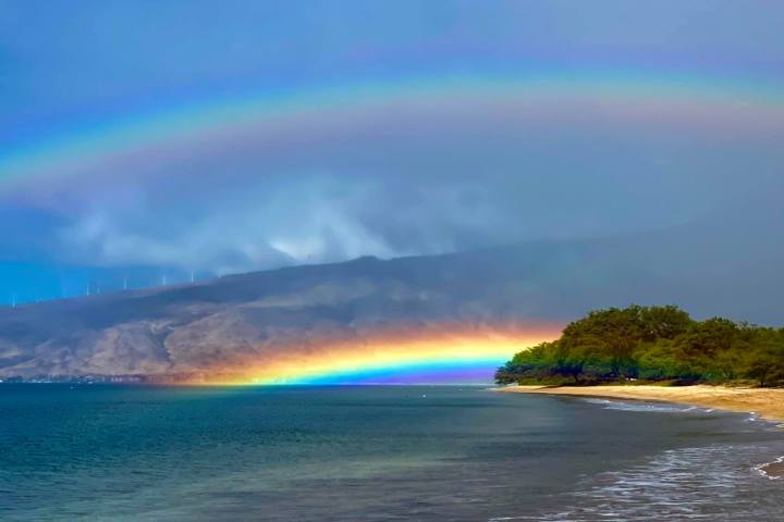 a rainbow over a body of water